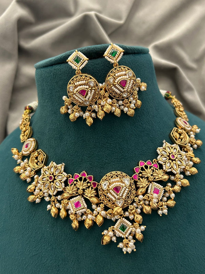 Antique Gold Temple Necklace Set – Ruby & Emerald Kundan Design with Pearls