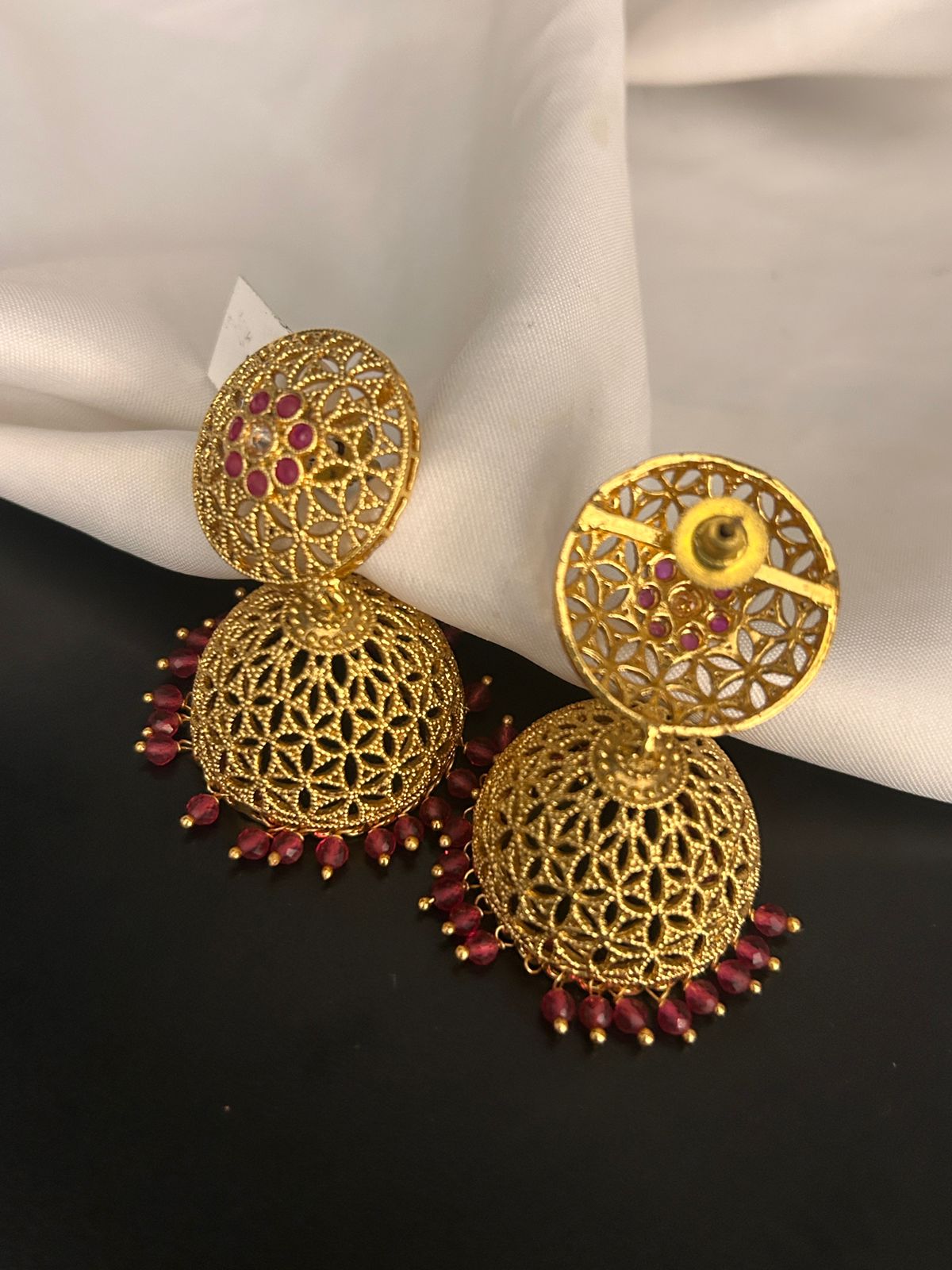 Traditional Gold Finish Jhumka Earrings with Ruby Beads
