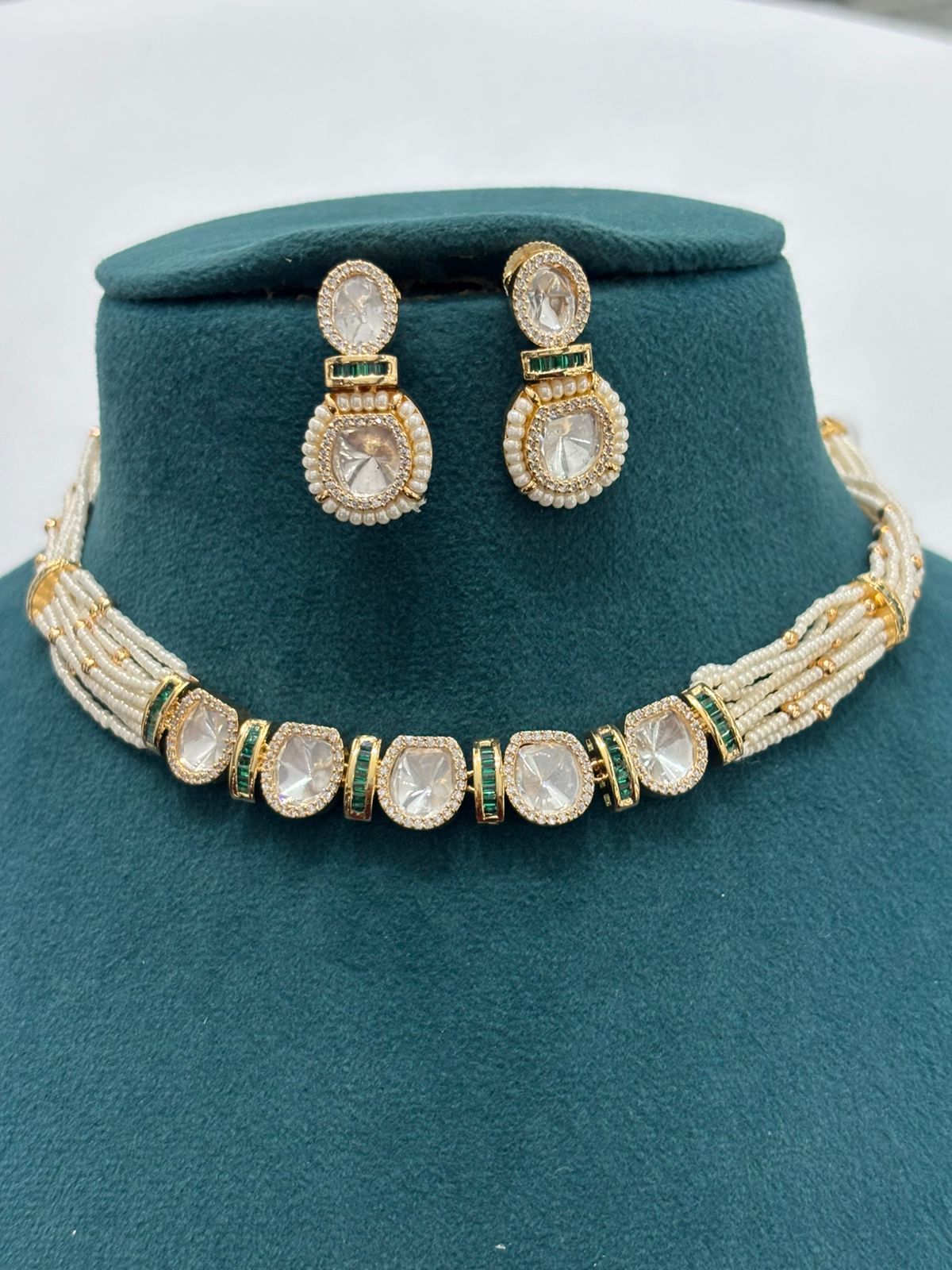 Pearl String Polki Choker Necklace Set with Emerald Accents – Premium Gold Finish