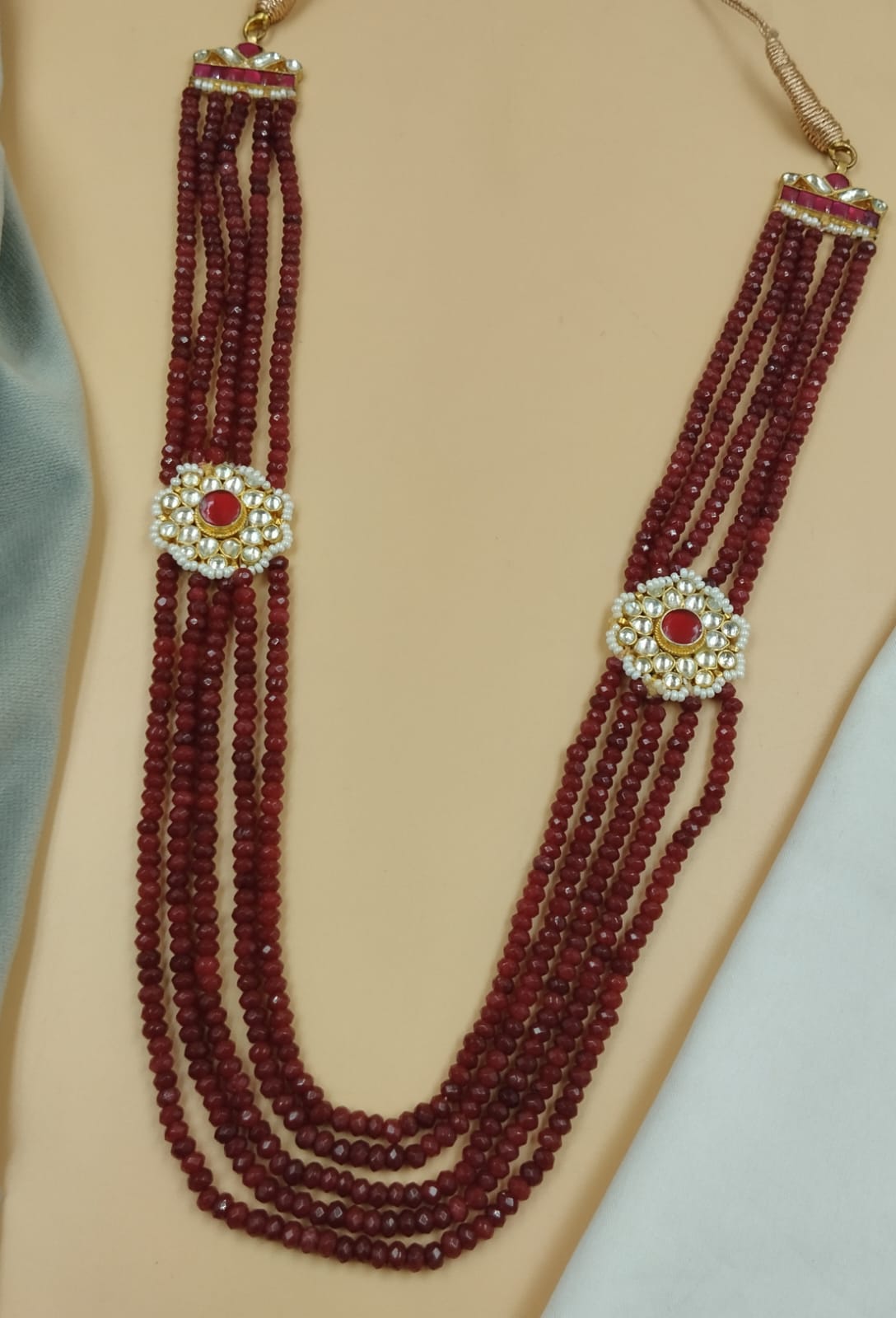 20-Inch Maroon Faceted Beads Mala with Dual Red Kundan Side Brooches