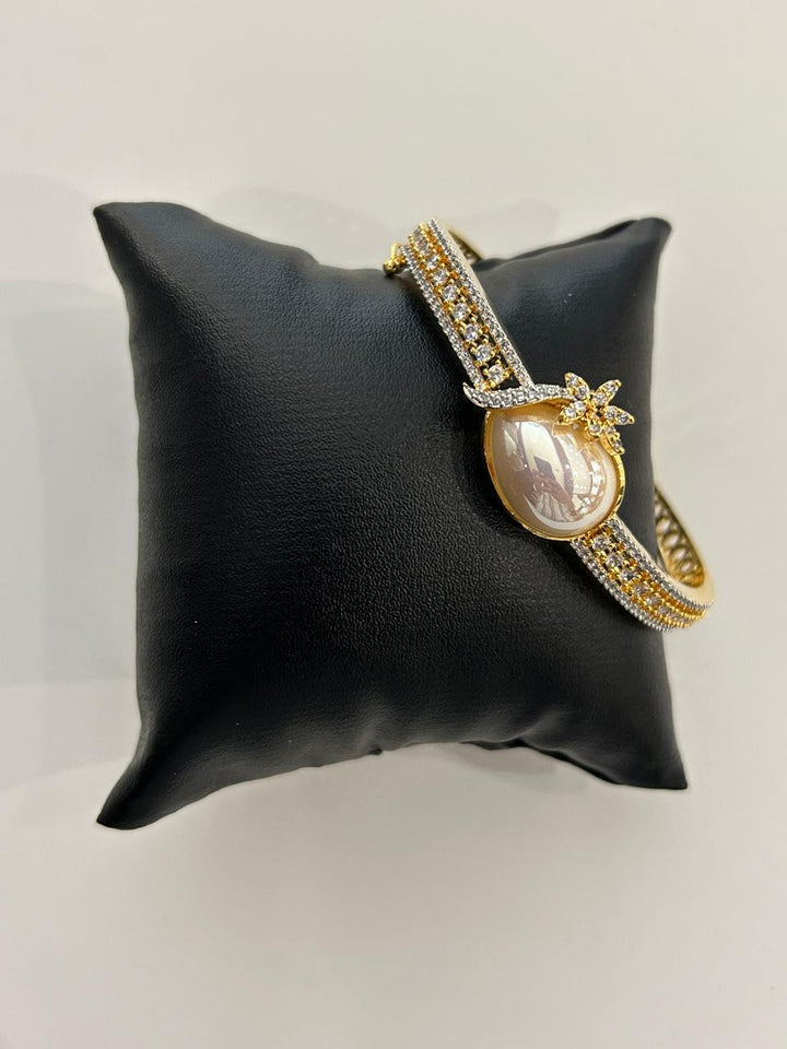 Elegant Pearl Bracelet with CZ Detailing Gold Finish Floral Design